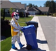 Person Pushing Recycling Bin