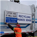 Recycle Signs - Aldon Boon Installing a Sign on the Recycling Truck