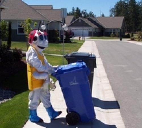 Person Pushing Recycling Bin
