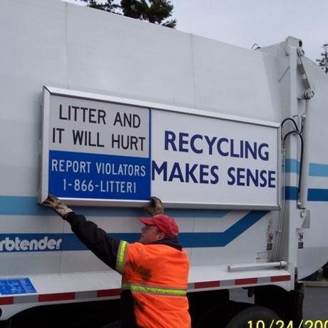 Recycle Signs - Aldon Boon Installing a Sign on the Recycling Truck